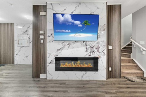 183 Cornerbrook Gate Ne, Calgary, AB - Indoor Photo Showing Living Room With Fireplace