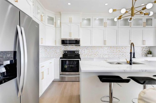 37 Royal Birch Landing Nw, Calgary, AB - Indoor Photo Showing Kitchen With Stainless Steel Kitchen With Double Sink With Upgraded Kitchen