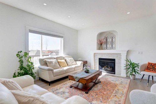 37 Royal Birch Landing Nw, Calgary, AB - Indoor Photo Showing Living Room With Fireplace