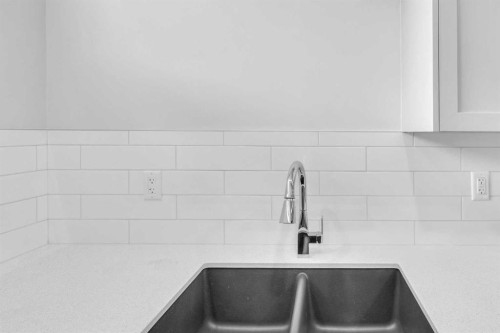 20 Iris Crescent, Okotoks, AB - Indoor Photo Showing Kitchen With Double Sink With Upgraded Kitchen