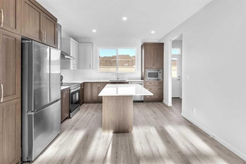 20 Iris Crescent, Okotoks, AB - Indoor Photo Showing Kitchen With Upgraded Kitchen