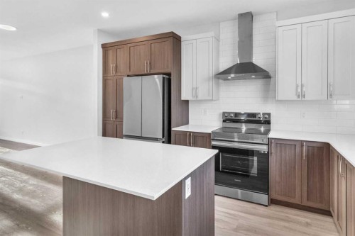 20 Iris Crescent, Okotoks, AB - Indoor Photo Showing Kitchen With Upgraded Kitchen