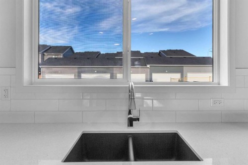 20 Iris Crescent, Okotoks, AB - Indoor Photo Showing Kitchen With Double Sink