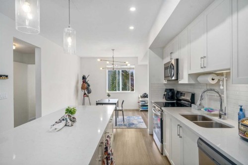 628 Copperstone Manor Se, Calgary, AB - Indoor Photo Showing Kitchen With Double Sink With Upgraded Kitchen