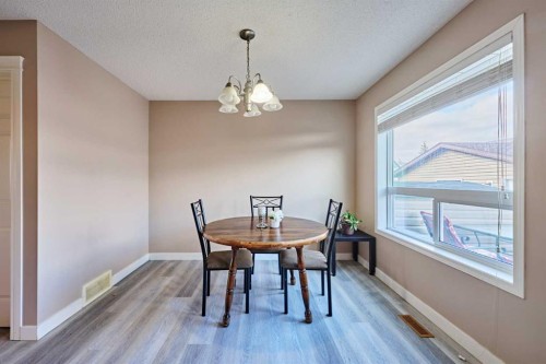188 Silverado Plains Close Sw, Calgary, AB - Indoor Photo Showing Dining Room