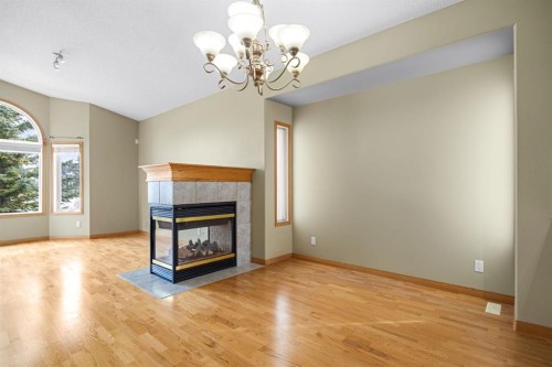 35 Scimitar Heath Nw, Calgary, AB - Indoor Photo Showing Living Room With Fireplace