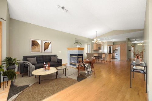 35 Scimitar Heath Nw, Calgary, AB - Indoor Photo Showing Living Room With Fireplace