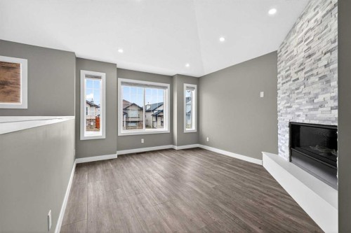 125 Saddlefield Crescent Ne, Calgary, AB - Indoor With Fireplace