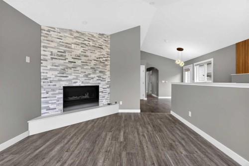 125 Saddlefield Crescent Ne, Calgary, AB - Indoor Photo Showing Living Room With Fireplace