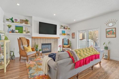 32 Chapalina Common Se, Calgary, AB - Indoor Photo Showing Living Room With Fireplace