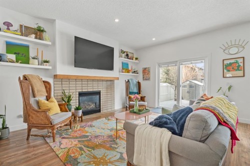 32 Chapalina Common Se, Calgary, AB - Indoor Photo Showing Living Room With Fireplace