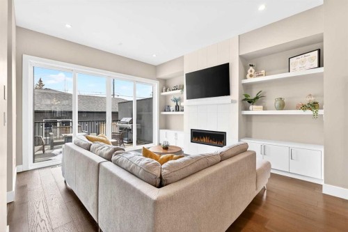 3736 44 Street Sw, Calgary, AB - Indoor Photo Showing Living Room With Fireplace