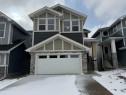 115 Sundown Crescent, Cochrane, AB  - Outdoor With Facade 