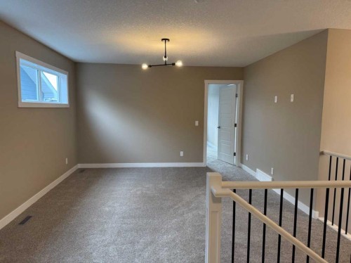 115 Sundown Crescent, Cochrane, AB - Indoor Photo Showing Other Room