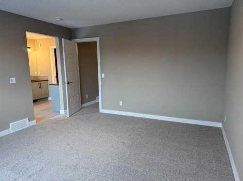 115 Sundown Crescent, Cochrane, AB - Indoor Photo Showing Other Room