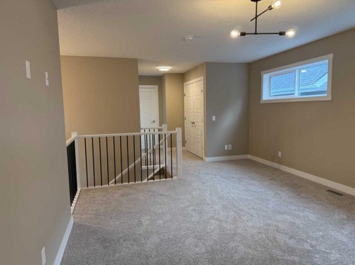 115 Sundown Crescent, Cochrane, AB - Indoor Photo Showing Other Room