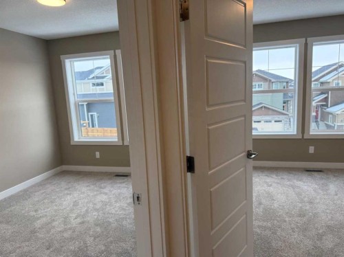 115 Sundown Crescent, Cochrane, AB - Indoor Photo Showing Other Room