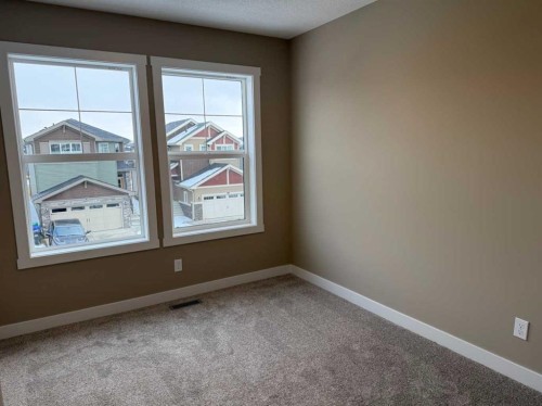 115 Sundown Crescent, Cochrane, AB - Indoor Photo Showing Other Room