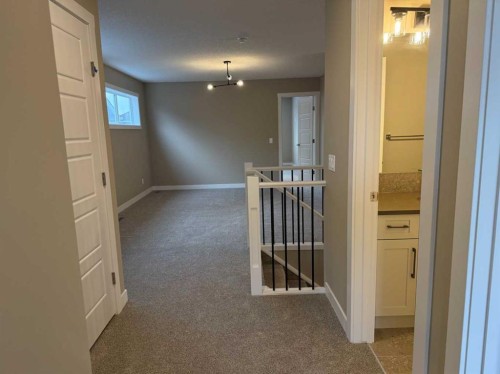 115 Sundown Crescent, Cochrane, AB - Indoor Photo Showing Other Room