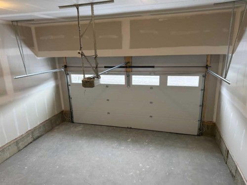 115 Sundown Crescent, Cochrane, AB - Indoor Photo Showing Garage