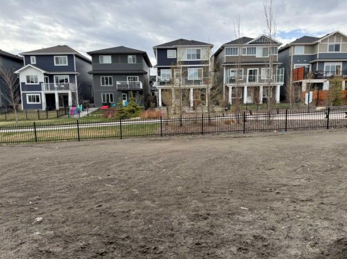 115 Sundown Crescent, Cochrane, AB - Outdoor With Facade