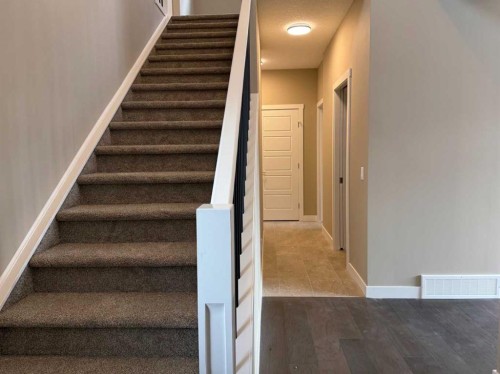 115 Sundown Crescent, Cochrane, AB - Indoor Photo Showing Other Room