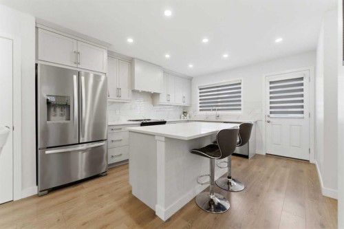 99 Aquila Way Nw, Calgary, AB - Indoor Photo Showing Kitchen With Upgraded Kitchen