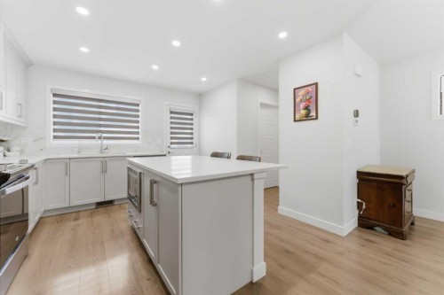 99 Aquila Way Nw, Calgary, AB - Indoor Photo Showing Kitchen With Upgraded Kitchen