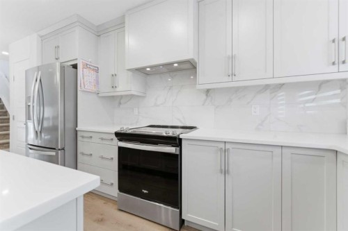 99 Aquila Way Nw, Calgary, AB - Indoor Photo Showing Kitchen With Upgraded Kitchen
