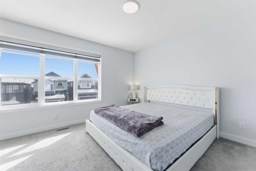 99 Aquila Way Nw, Calgary, AB - Indoor Photo Showing Bedroom