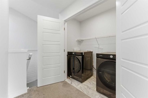 99 Aquila Way Nw, Calgary, AB - Indoor Photo Showing Laundry Room