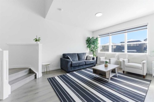 99 Aquila Way Nw, Calgary, AB - Indoor Photo Showing Living Room