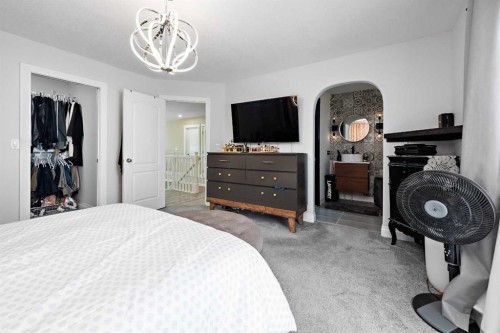 66 Royal Highland Road Nw, Calgary, AB - Indoor Photo Showing Bedroom