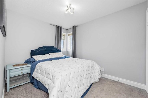 66 Royal Highland Road Nw, Calgary, AB - Indoor Photo Showing Bedroom