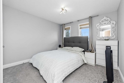 66 Royal Highland Road Nw, Calgary, AB - Indoor Photo Showing Bedroom
