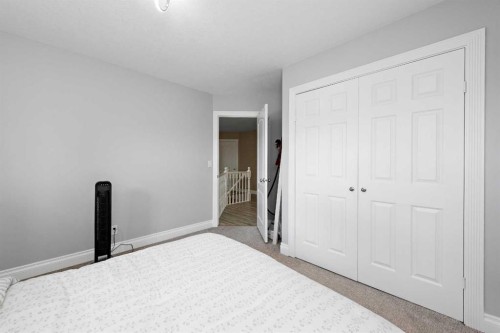 66 Royal Highland Road Nw, Calgary, AB - Indoor Photo Showing Bedroom