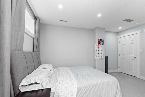 66 Royal Highland Road Nw, Calgary, AB - Indoor Photo Showing Bedroom