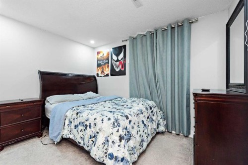 66 Royal Highland Road Nw, Calgary, AB - Indoor Photo Showing Bedroom
