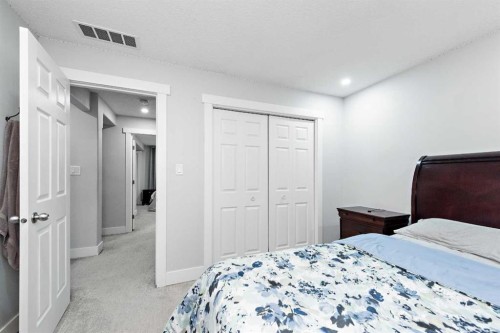 66 Royal Highland Road Nw, Calgary, AB - Indoor Photo Showing Bedroom