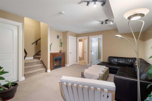 536 Quarry Park Boulevard Se, Calgary, AB - Indoor With Fireplace