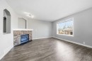 83 Cranfield Crescent Se, Calgary, AB  - Indoor Photo Showing Living Room With Fireplace 