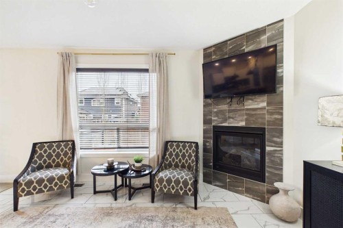 156 Rainbow Falls Heath, Chestermere, AB - Indoor Photo Showing Living Room With Fireplace