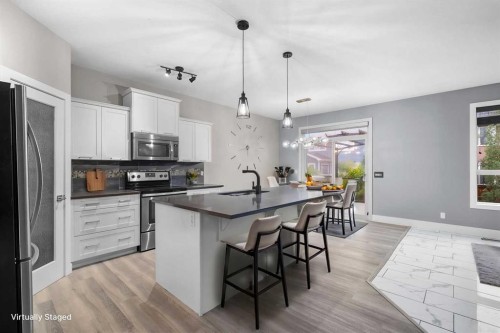 156 Rainbow Falls Heath, Chestermere, AB - Indoor Photo Showing Kitchen With Stainless Steel Kitchen With Upgraded Kitchen