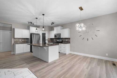 156 Rainbow Falls Heath, Chestermere, AB - Indoor Photo Showing Kitchen With Stainless Steel Kitchen With Upgraded Kitchen