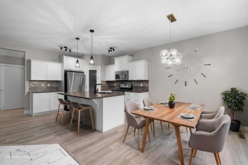 156 Rainbow Falls Heath, Chestermere, AB - Indoor Photo Showing Other Room