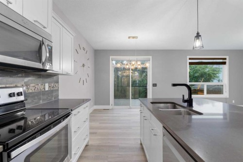 156 Rainbow Falls Heath, Chestermere, AB - Indoor Photo Showing Kitchen With Stainless Steel Kitchen With Double Sink