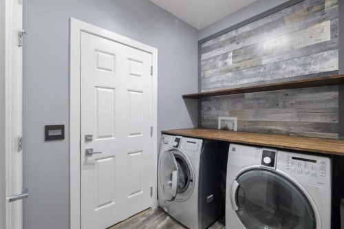 156 Rainbow Falls Heath, Chestermere, AB - Indoor Photo Showing Laundry Room