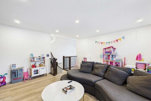 156 Rainbow Falls Heath, Chestermere, AB - Indoor Photo Showing Living Room