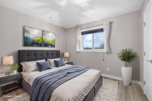 156 Rainbow Falls Heath, Chestermere, AB - Indoor Photo Showing Bedroom
