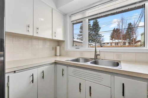 33 Warwick Drive Sw, Calgary, AB - Indoor Photo Showing Kitchen With Double Sink
